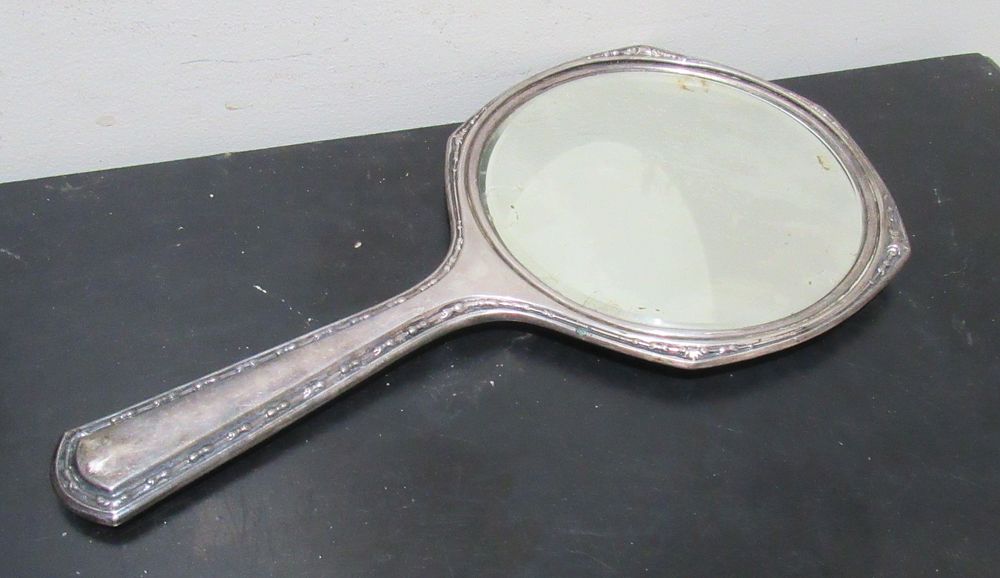 Lot 579: BUY-IT-NOW PRICE $125. ANTIQUE STERLING SILVER MIRROR.