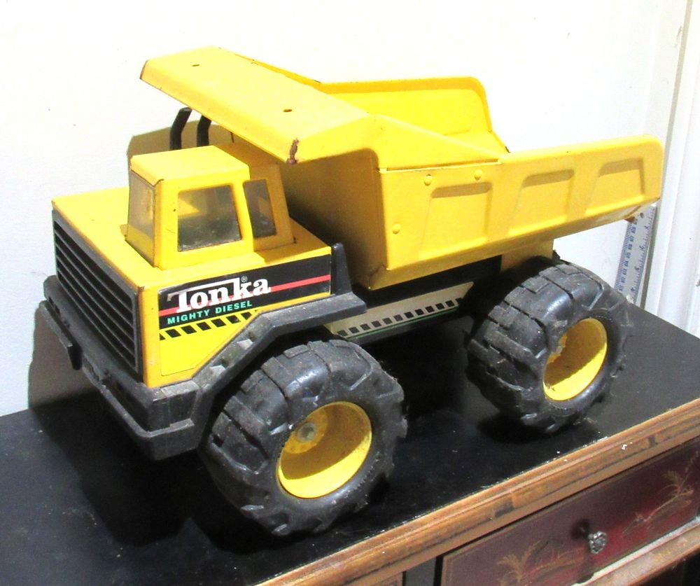 Lot 593: BUY-IT-NOW PRICE $25. MIGHTY DIESEL TONKA DUMP TRUCK. VG CONDITION WITH MINOR OXIDATION AS PICTURED.