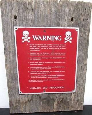 BUY-IT-NOW PRICE $80. RARE ONTARIO SILO ASSOCIATION WARNING SIGN WITH SKULL & CROSSBONES. 