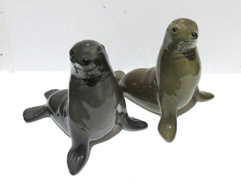 Lot 638: BUY-IT-NOW PRICE $15. GOEBEL/HUMMEL SEAL SALT & PEPPER SHAKERS.