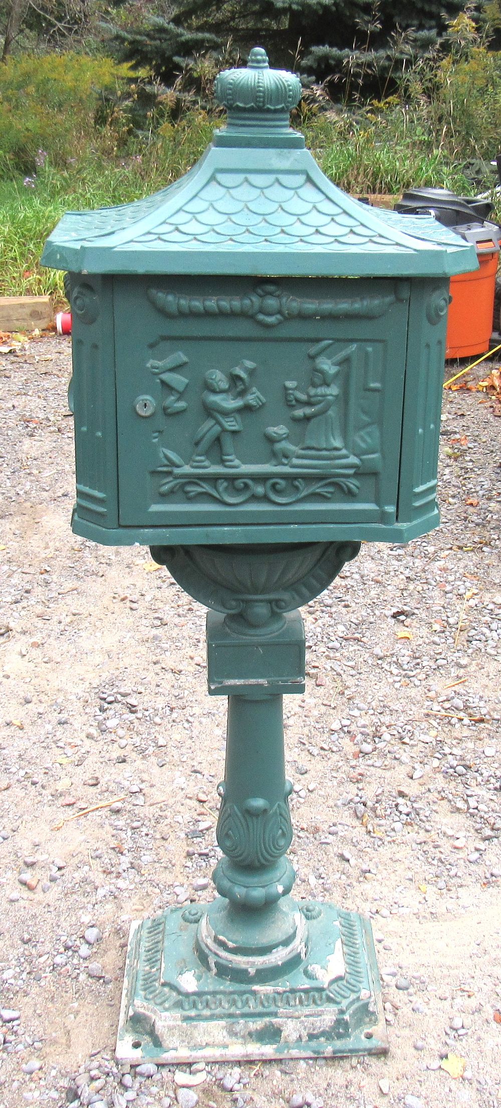 Lot 649: BUY-IT-NOW PRICE $40. CAST ALUMINUM MAIL BOX/GARDEN DECOR.. 46" HIGH. NO KEY. MISSING MAIL SLOT COVER