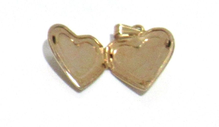 Lot 654: BUY-IT-NOW PRICE $145. 14KT GOLD HEART LOCKET.