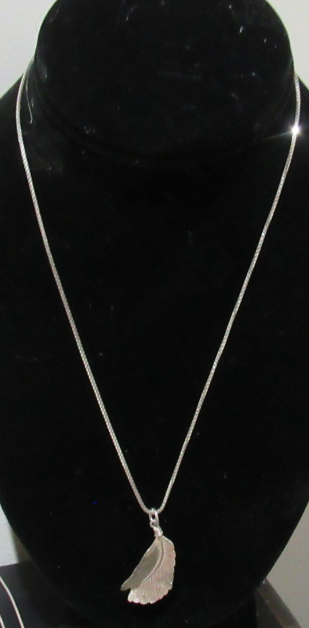 Lot 656: BUY-IT-NOW PRICE $50. STERLING SILVER NECKLACE AND LEAF PENDANT..