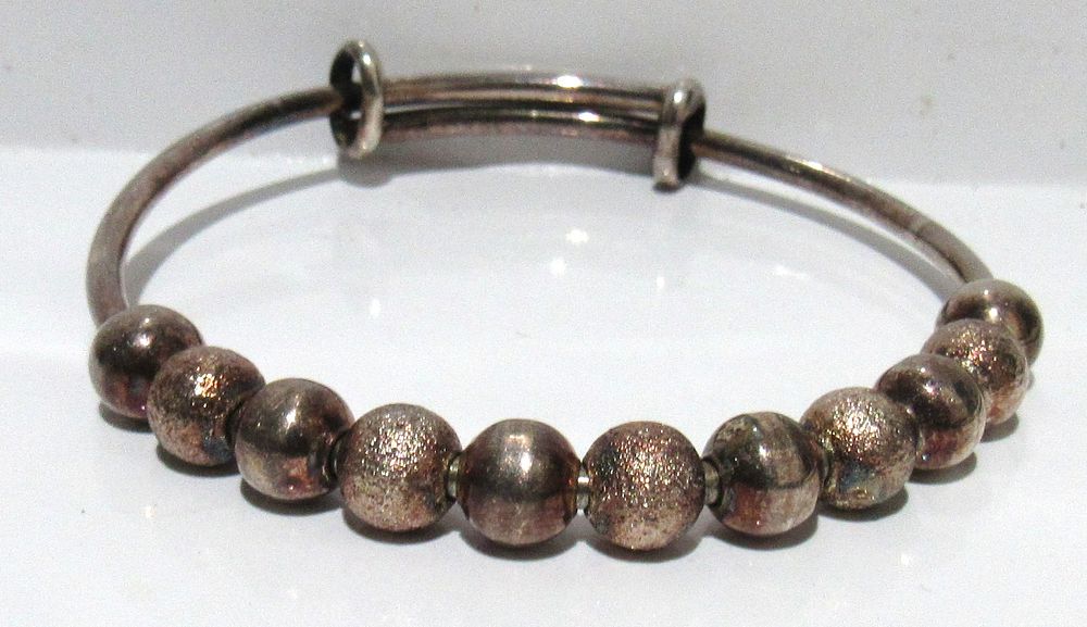 Lot 657: BUY-IT-NOW PRICE $50. STERLING SILVER BRACELET.