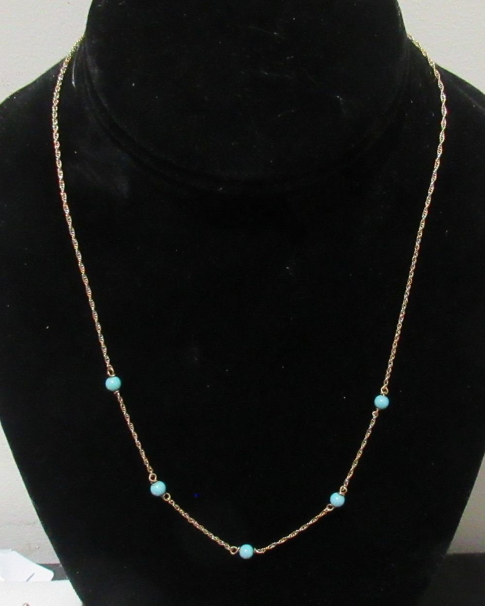 Lot 660: BUY-IT-NOW PRICE $195. 10KT ROSE GOLD NECKLACE WITH TURQUOISE ADORNMENTS. OVERALL LENGTH 18.75",