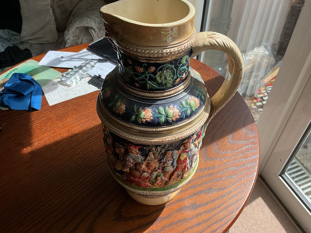 Lot 212: A Large German Relief-Moulded Salt-Glazed Stoneware Pitcher