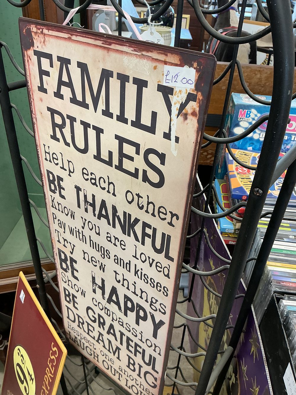 Lot 282: A Contemporary Printed Tin Family Rules Wall Plaque