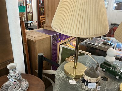 Mid-century modern style brass-tone table lamp with pleated fabric shade
