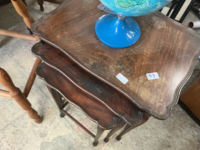 A Trio of Mahogany-Finished Scalloped Top Nesting Tables