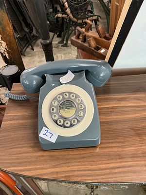 A Retro-Style Push-Button Telephone in Petrol Blue