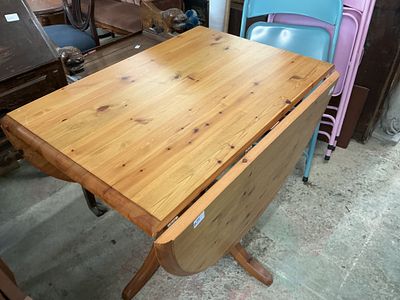 A Contemporary Pine Drop-Leaf Dining Table