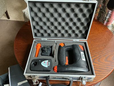 TorQ Cordless Stapler and Tacker Set in Fitted Carrying Case. A TorQ cordless power staple gun 