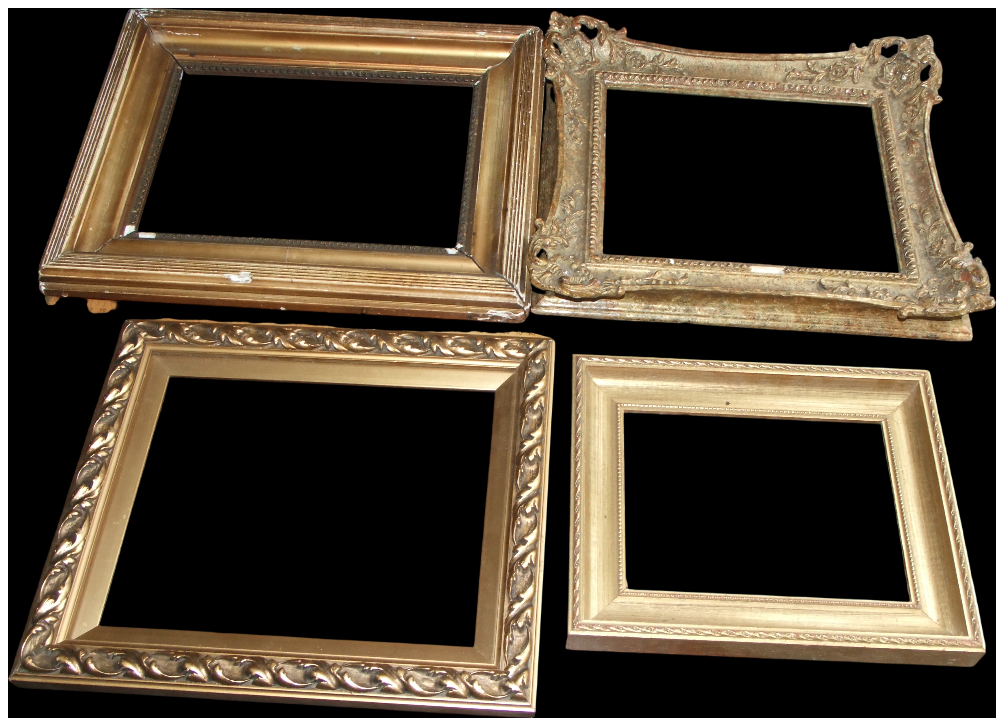 An Assortment of Four Gilt Wood and Composition Picture Frames