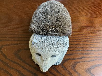 Cast Composition and Coir Fibre Hedgehog Boot Scraper. A decorative boot scraper and brush in 