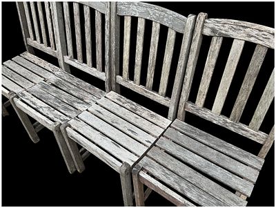 A Set of Weathered Hardwood Garden Seats. A set of hardwood garden seats, likely teak, featuring 