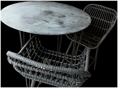 Three items of contemporary garden bistro furniture comprising a circular table and two chairs. A 