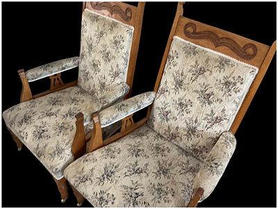 A Pair of Late Victorian Carved Oak Fireside Armchairs. A pair of late Victorian or Edwardian 