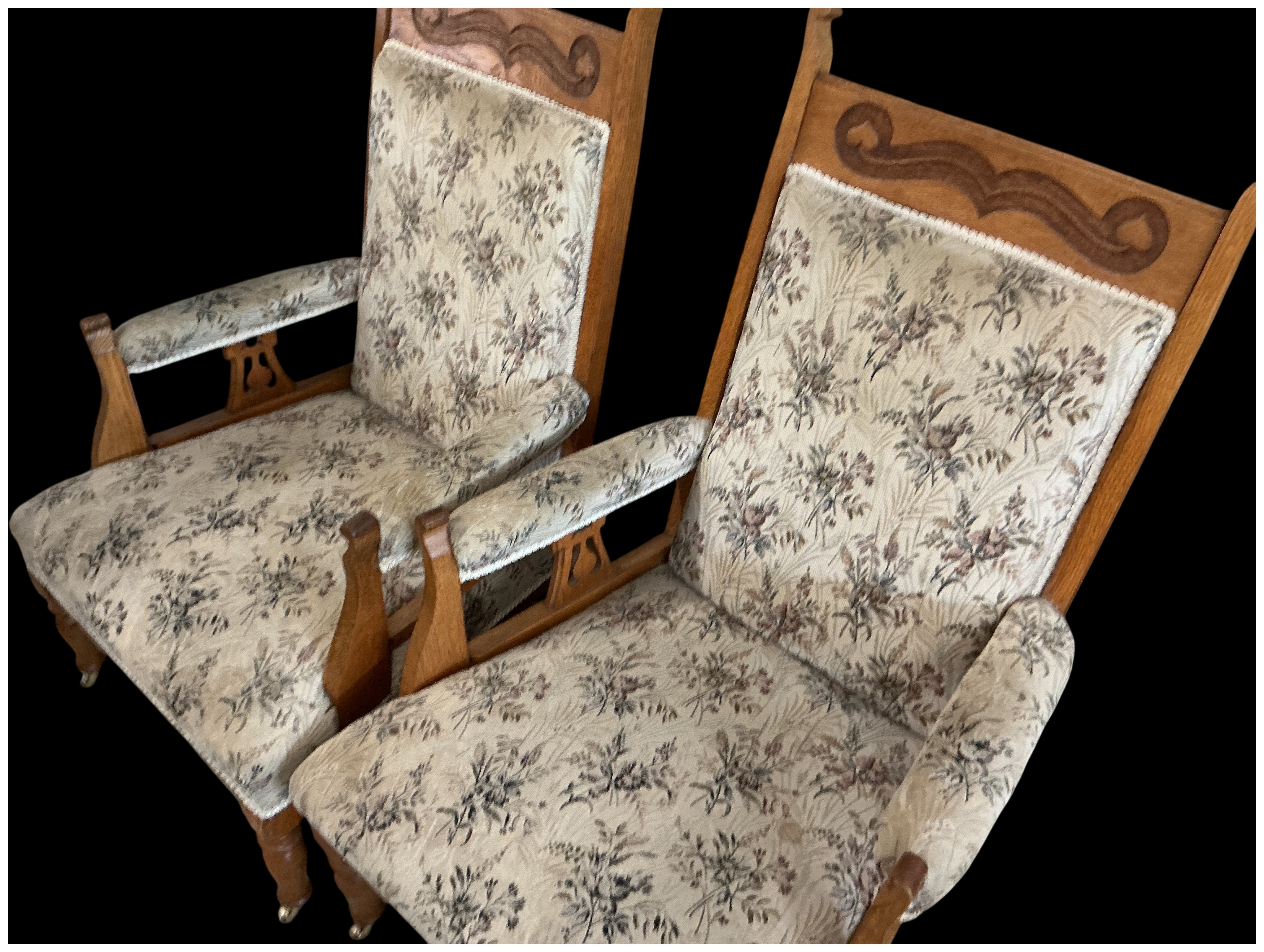 A Pair of Late Victorian Carved Oak Fireside Armchairs