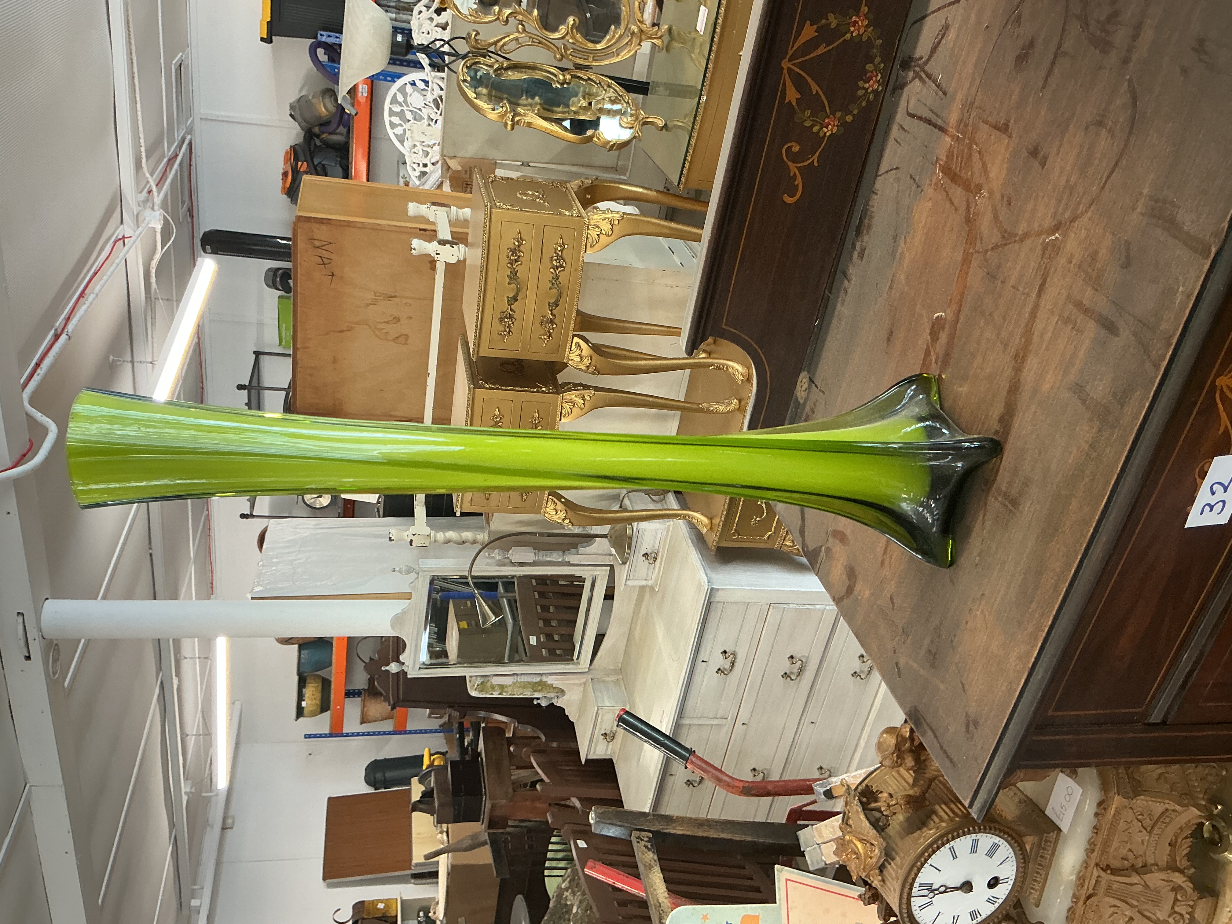 A large Mid-Century Modern style swung art glass floor vase in lime green and smoked black