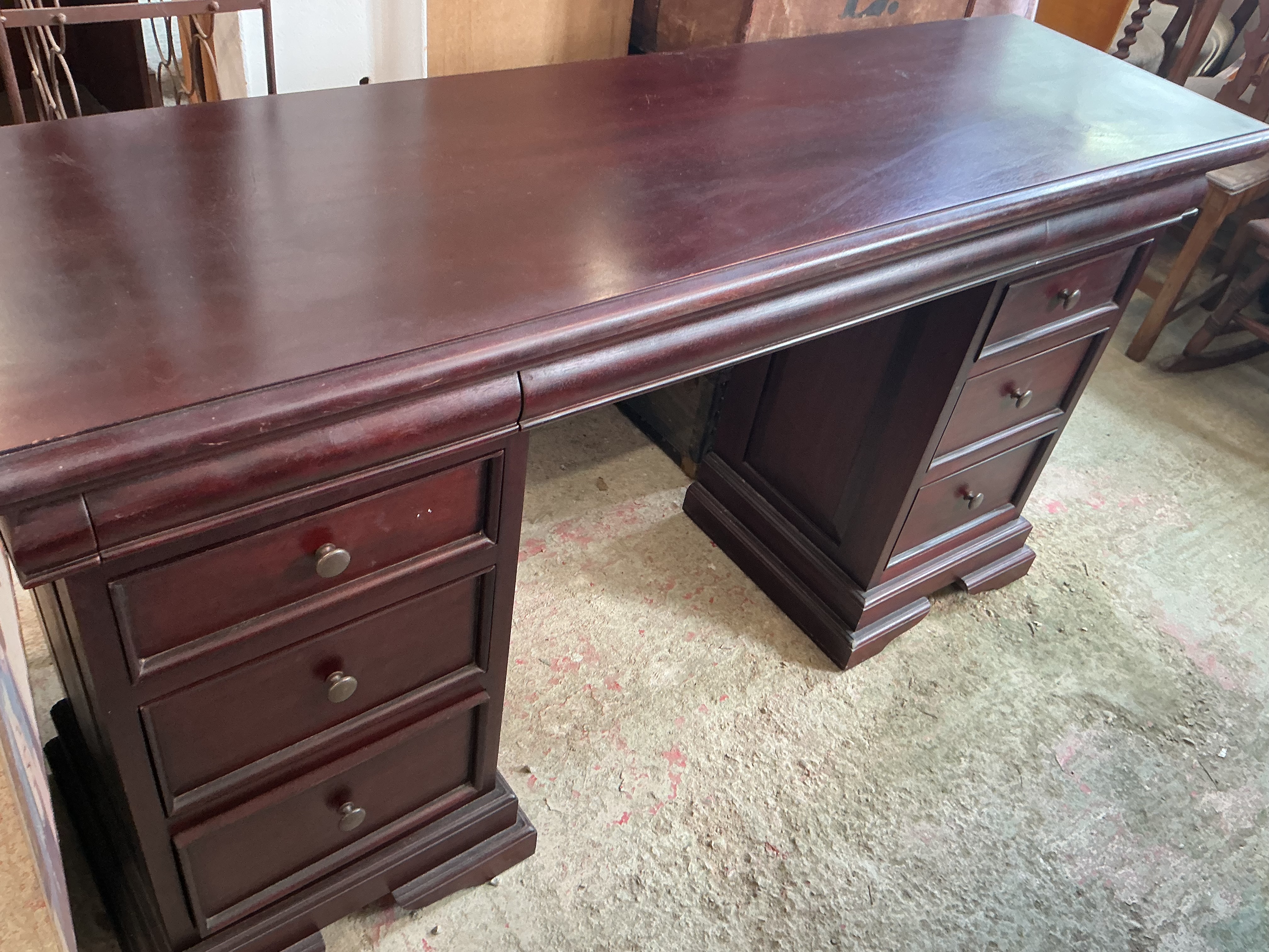 A Traditional Style Mahogany Finished Twin Pedestal Desk