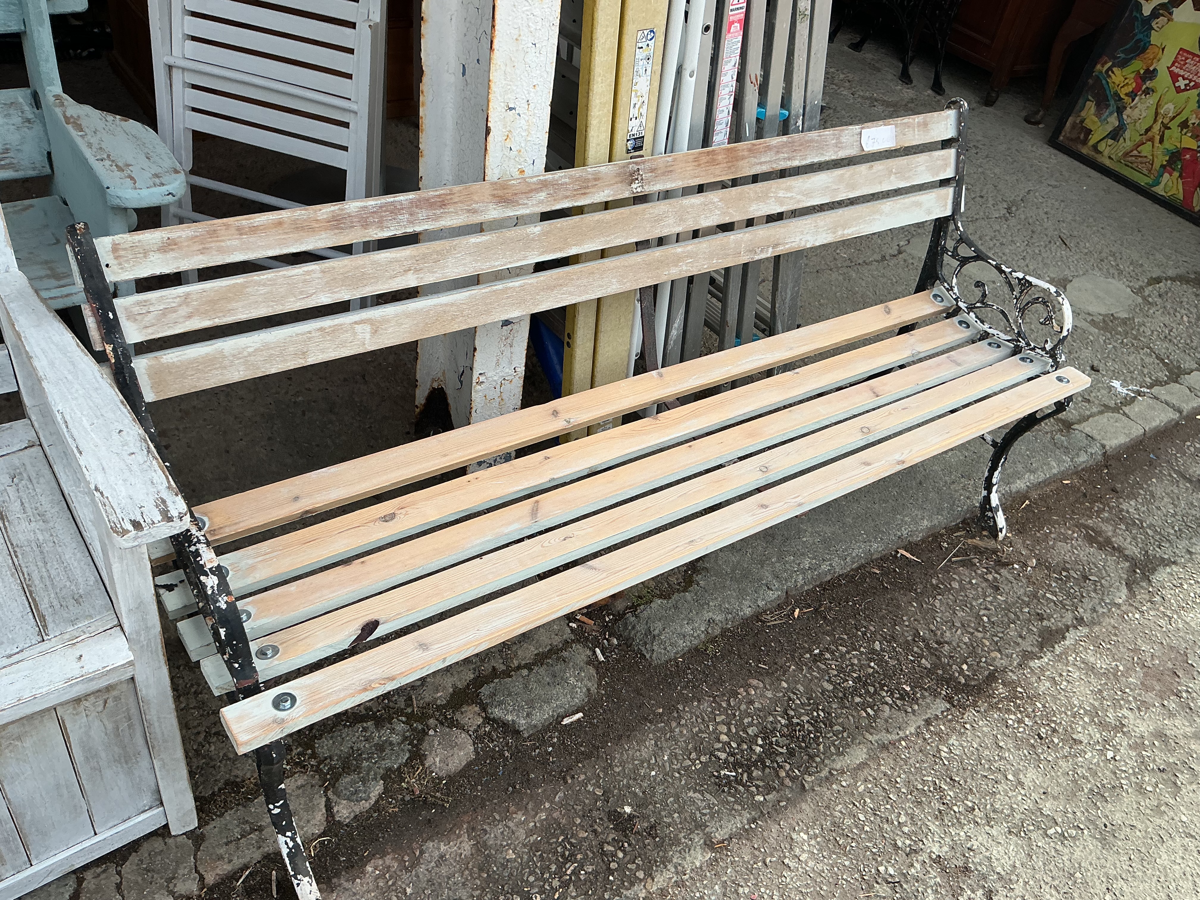 A Victorian Style Cast Iron and Slatted Wood Garden Bench