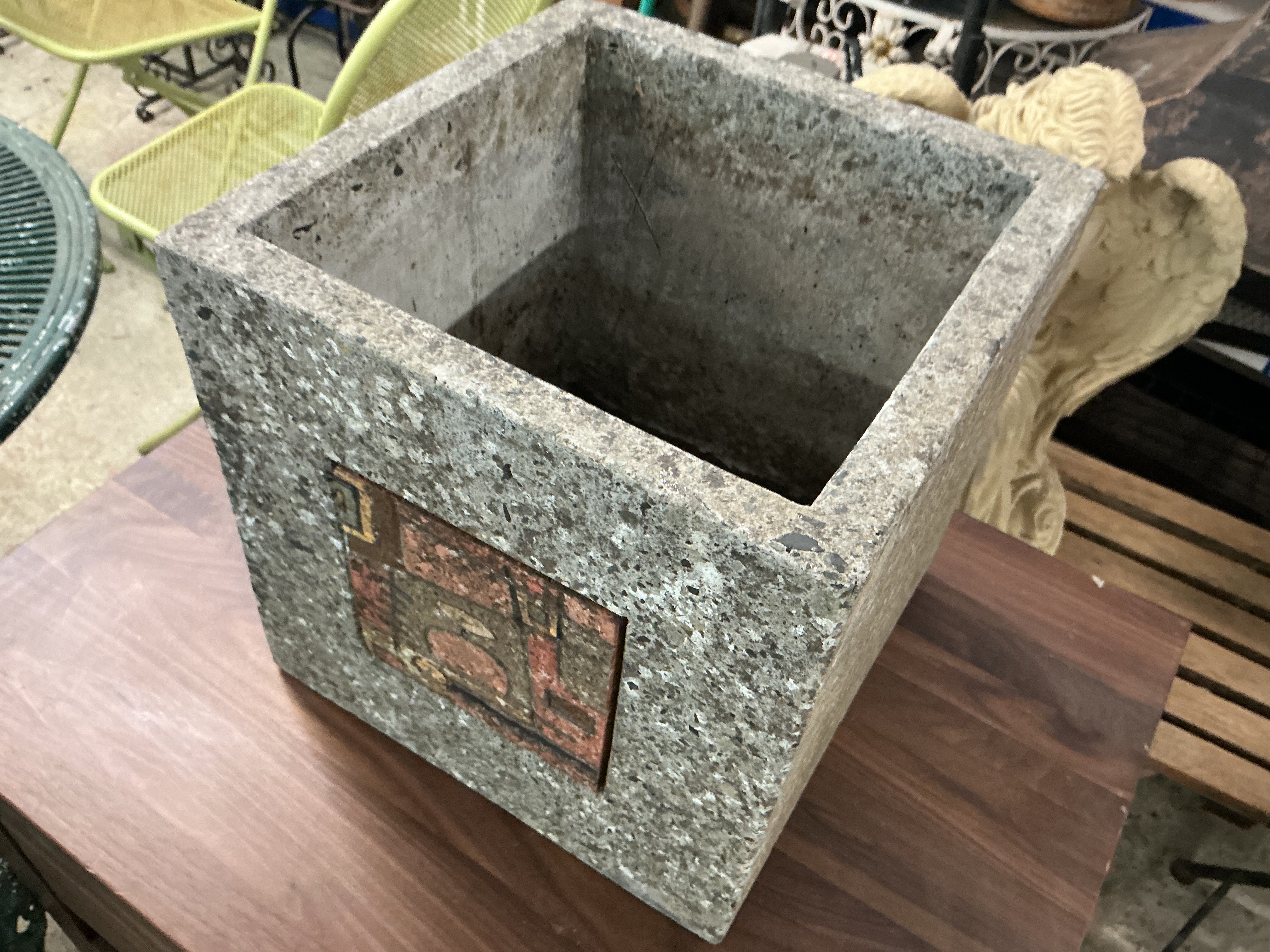 A Brutalist-style Square Reconstituted Stone Garden Planter with Abstract Inset Plaque