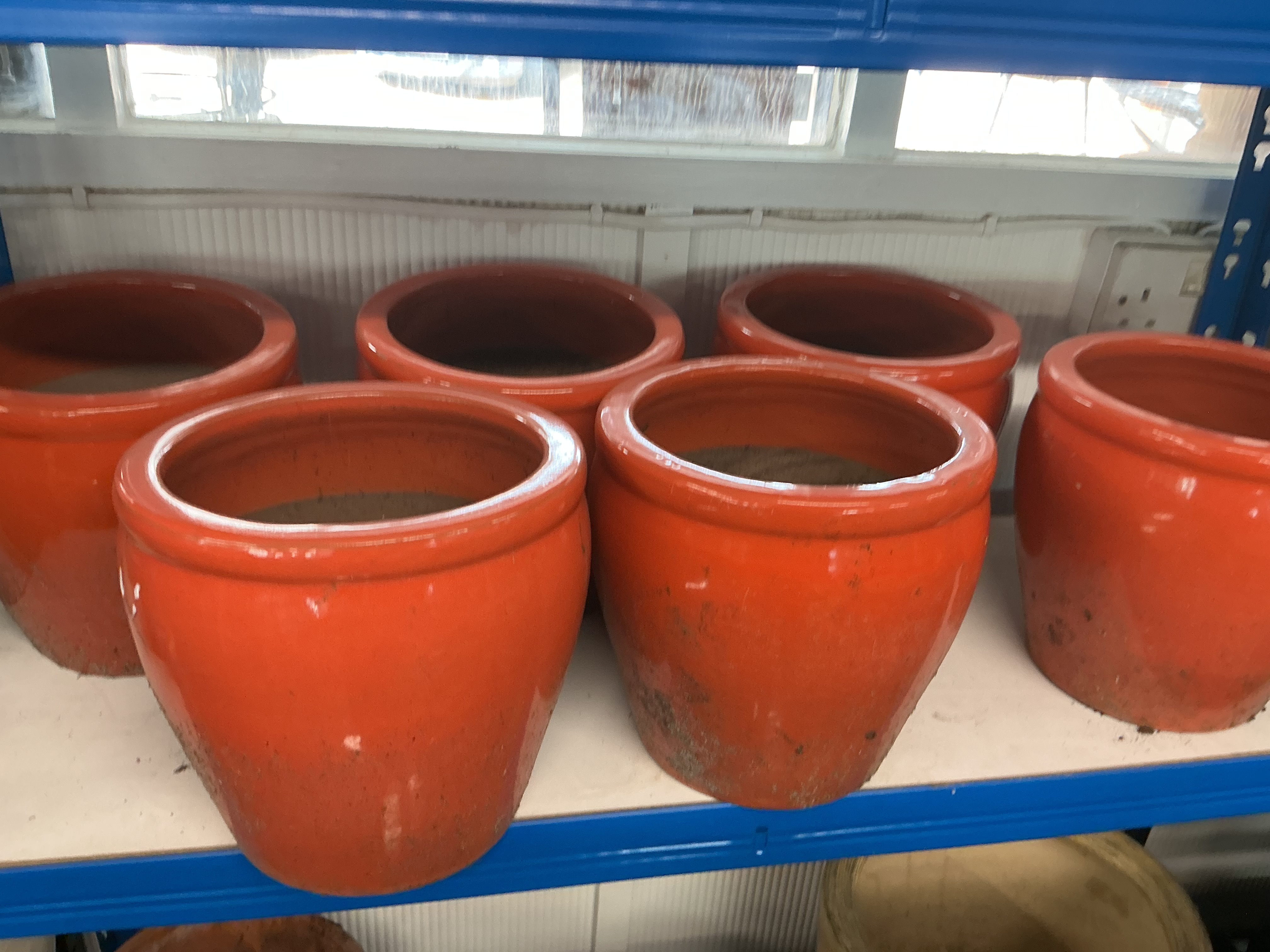 A Set of 6 Contemporary Orange Glazed Earthenware Garden Planters