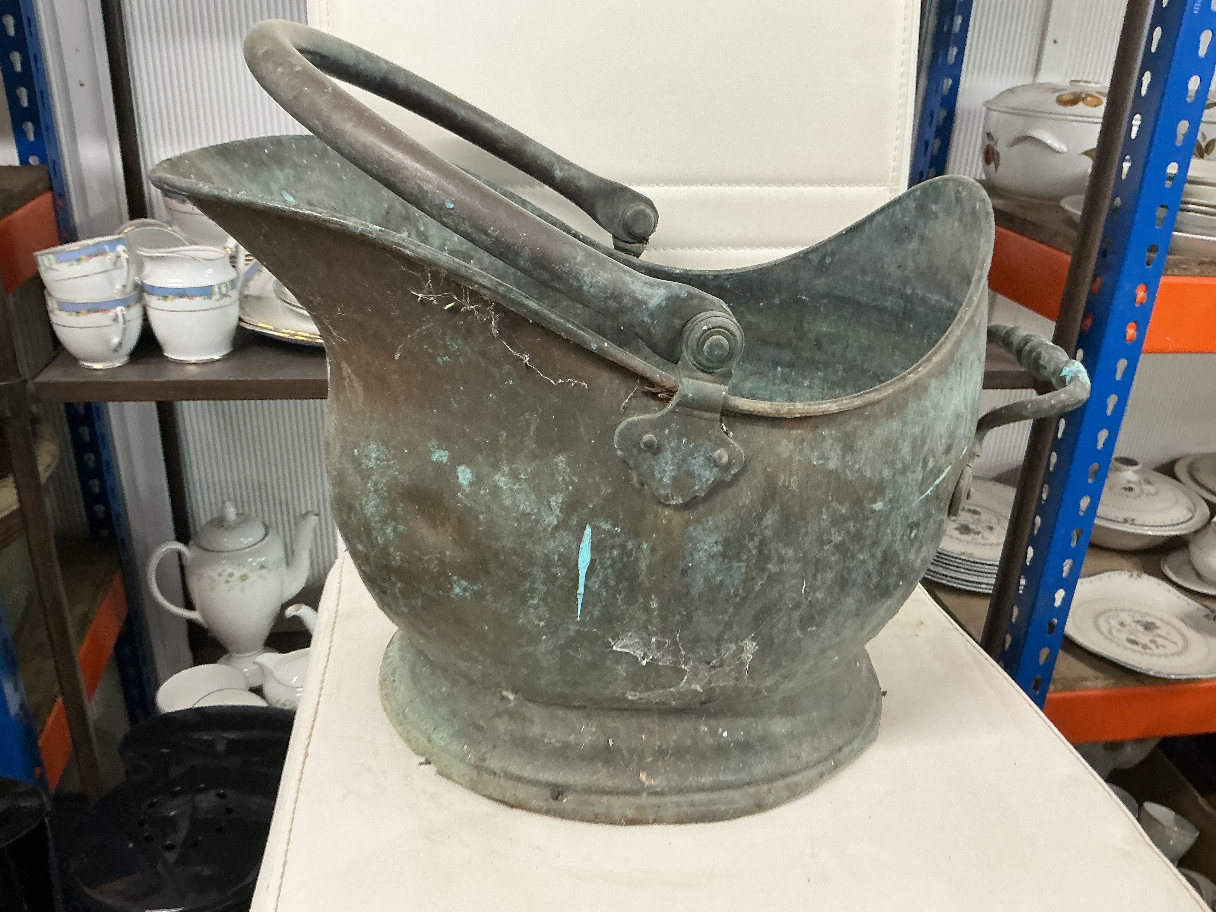 A Victorian copper helmet-shaped coal scuttle