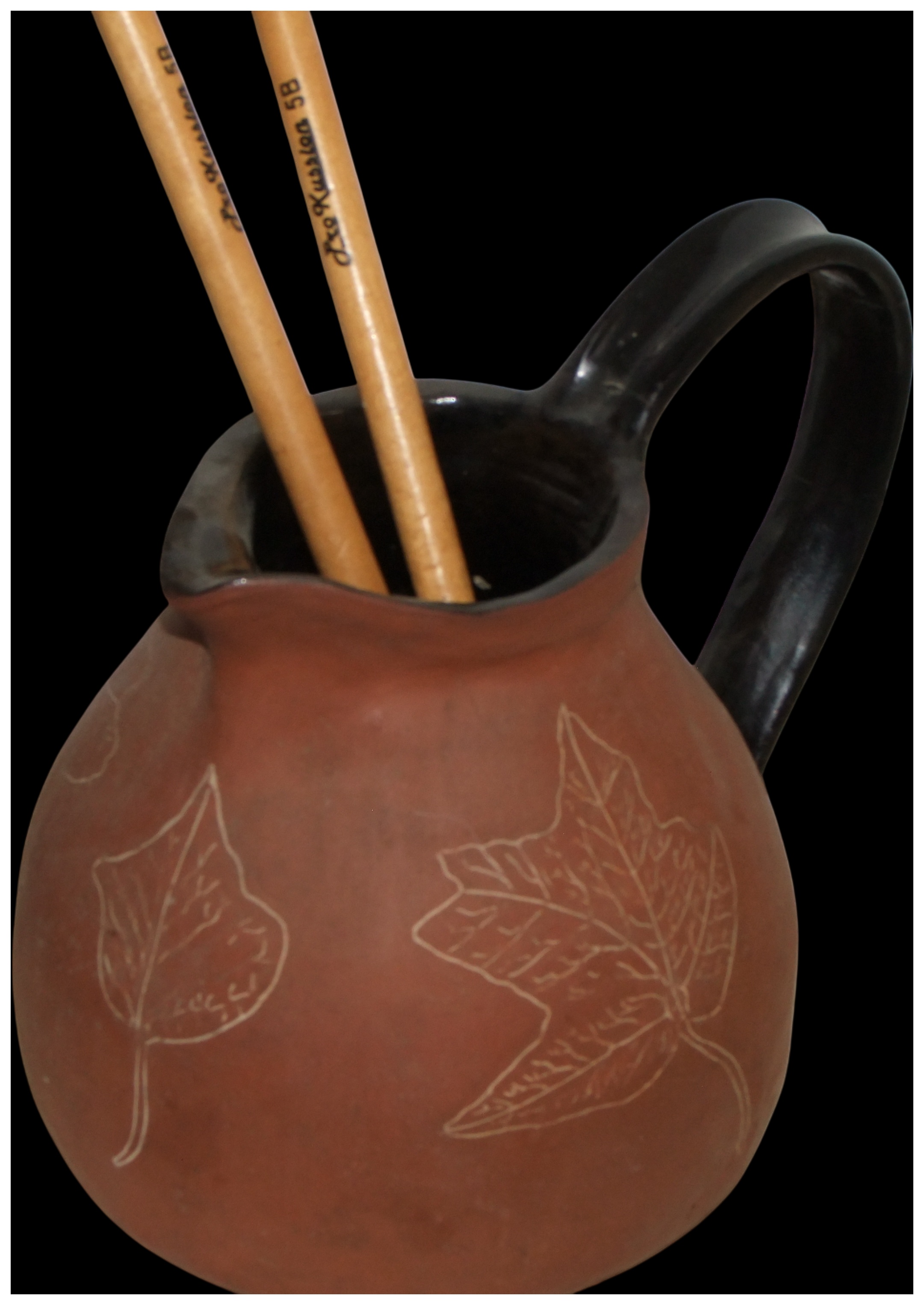 A Studio Pottery Red Earthenware Pitcher with Sgraffito Leaf Decoration