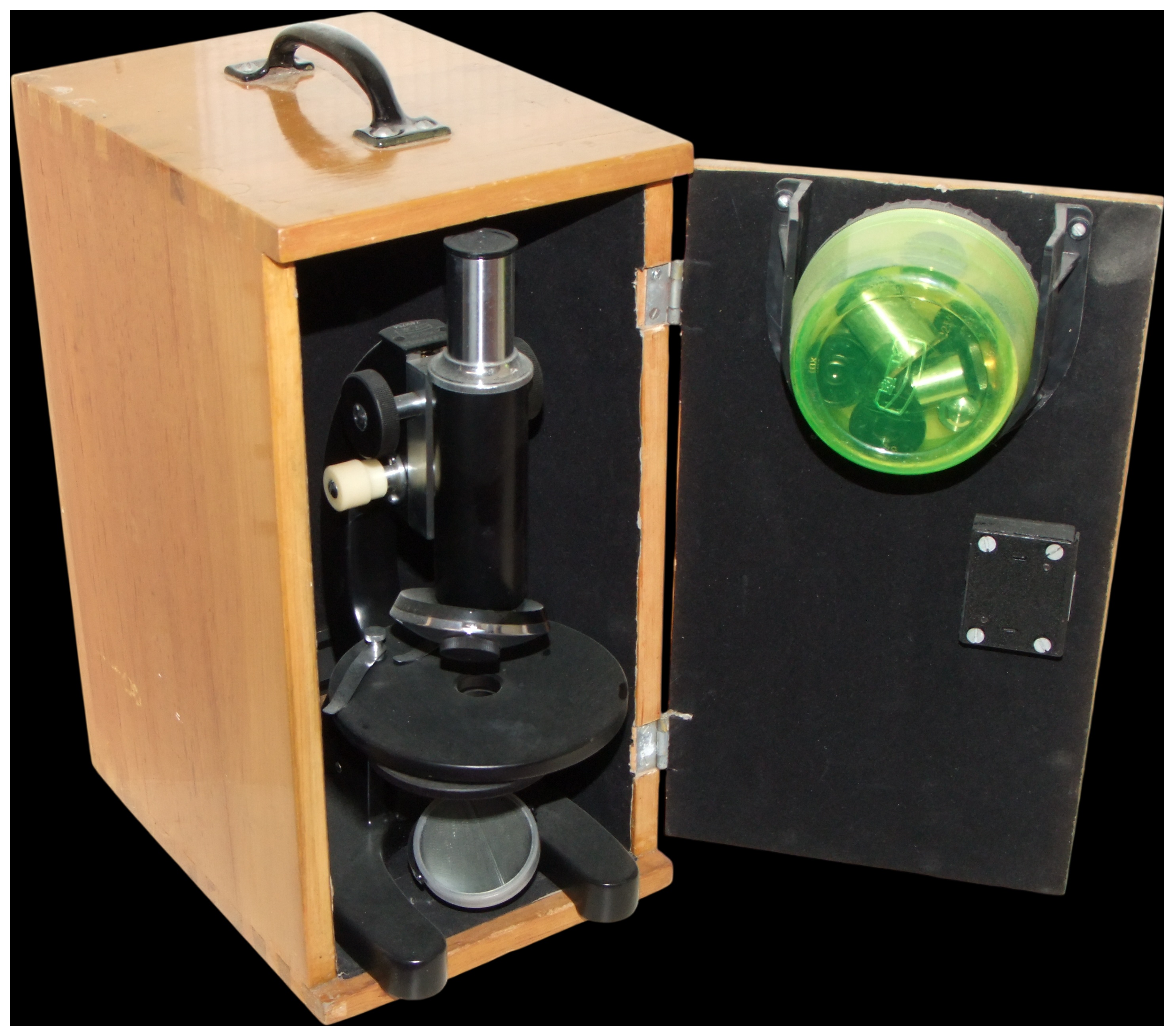 A mid-20th-century monocular compound microscope in a fitted wooden case