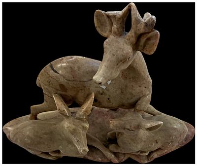 A Hand-Carved Soapstone Deer Family Group. A hand-carved soapstone sculpture depicting a family 