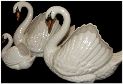 A Trio of Mid-20th Century Glazed Ceramic Swan Planters. A trio of graduated ceramic planters 