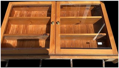 A Pine Wall Mounted Glazed Display Cabinet. A wall mounted display cabinet constructed from 