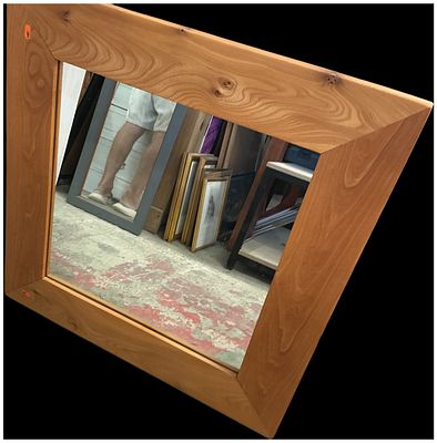 A Late 20th Century Figured Wood Framed Wall Mirror. A square wall mirror featuring a wide 