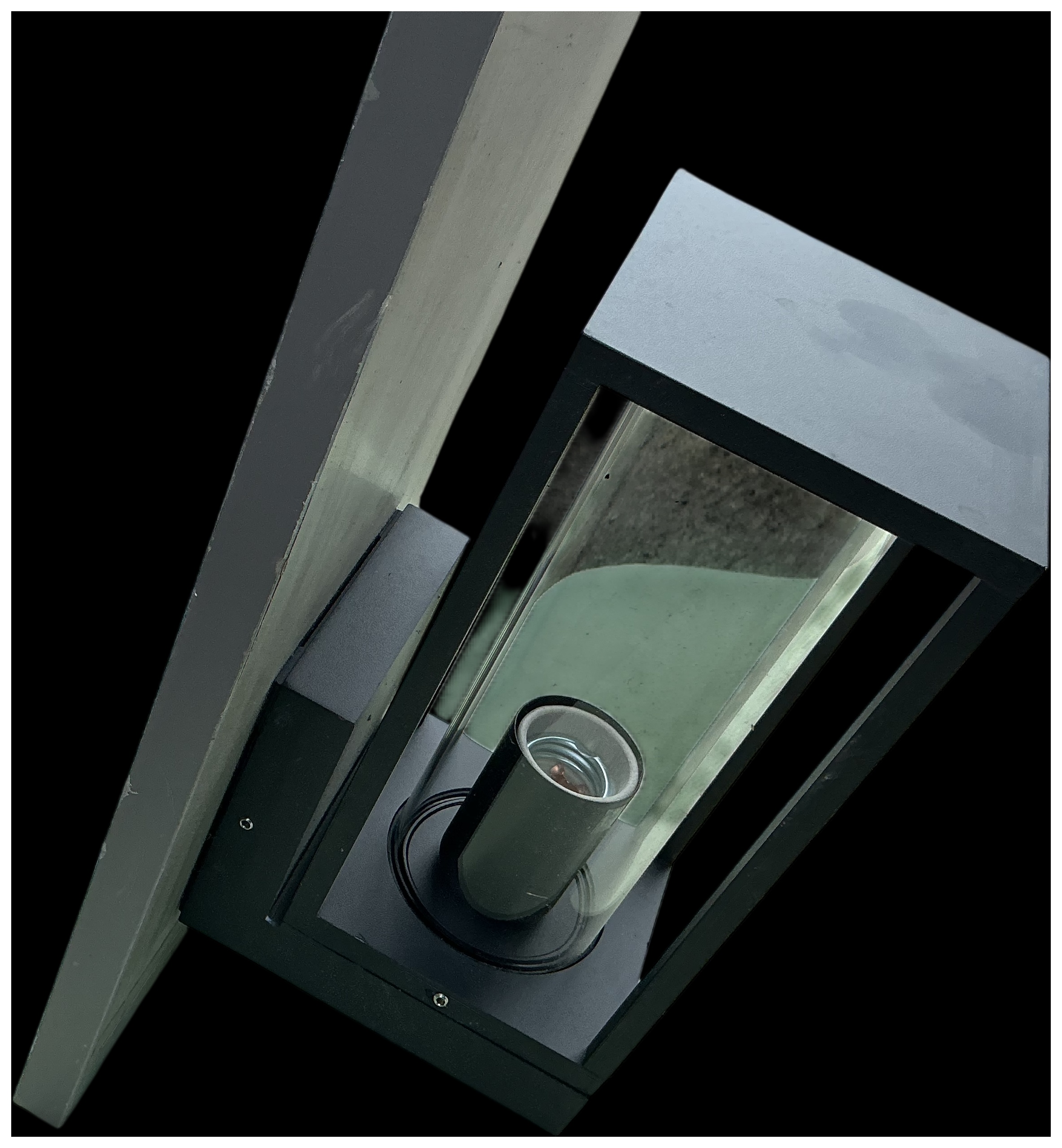 A Modern Minimalist Black Powder-Coated Metal and Glass Outdoor Wall Lantern
