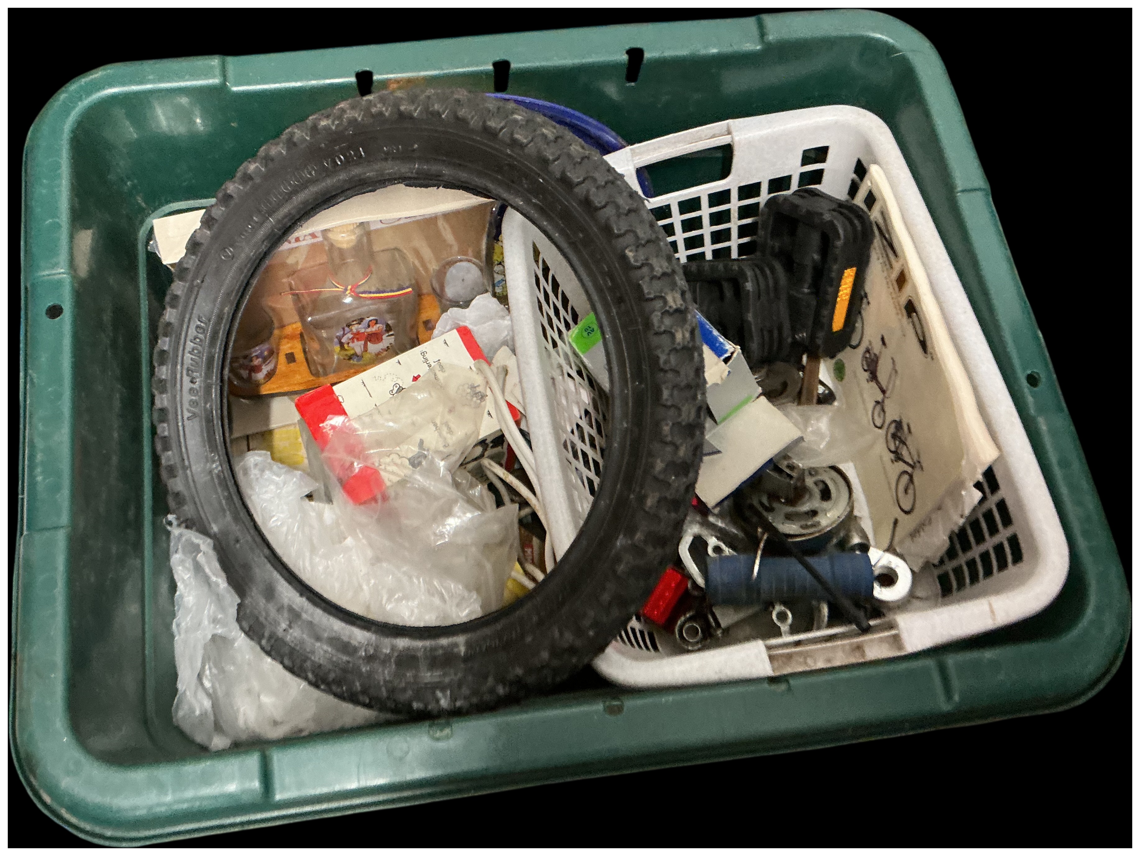 An Assortment of Bicycle Tyres, Pedals, and Miscellaneous Mechanical Components