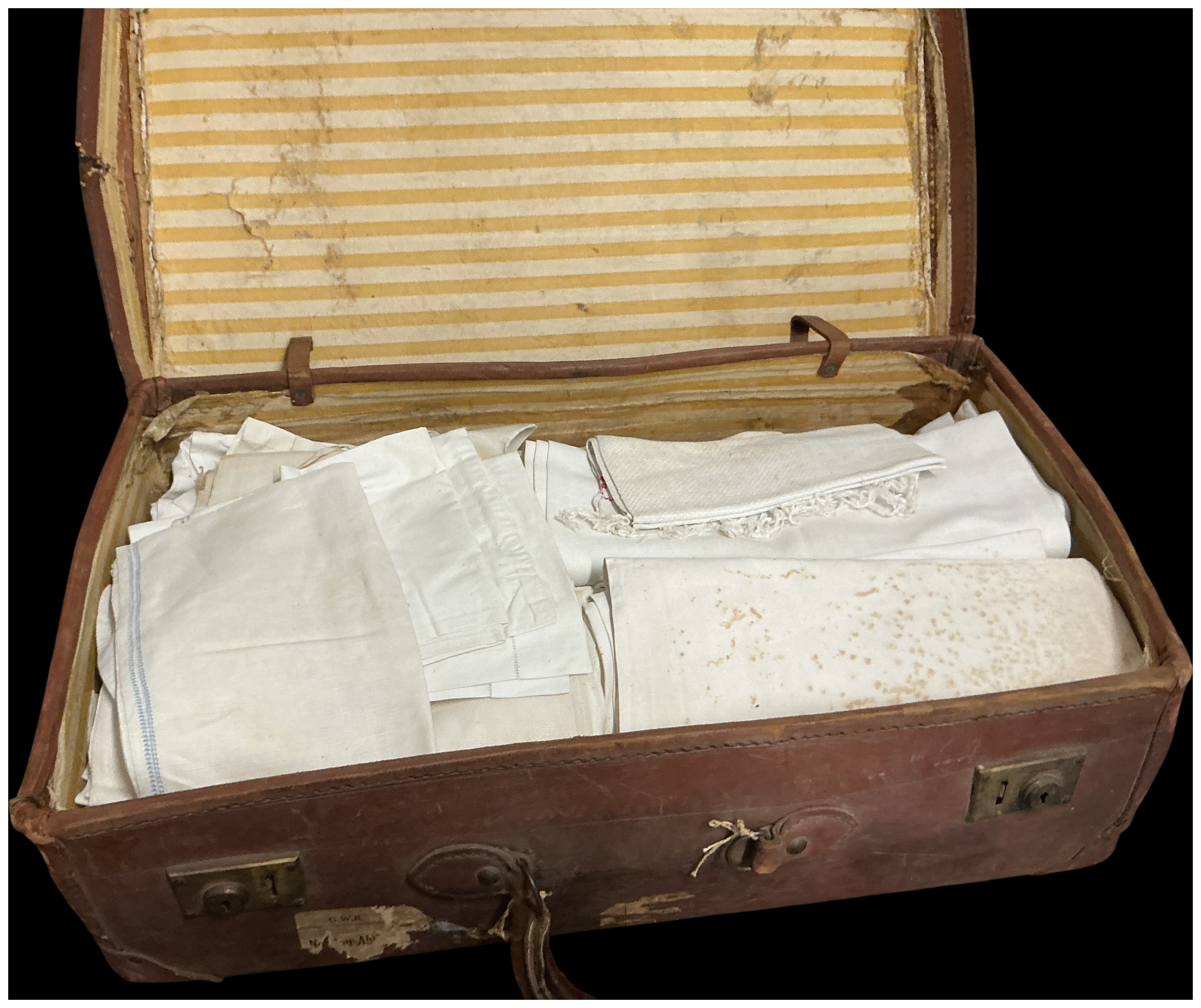 A Mid-20th Century GWR Travel Suitcase containing an Assortment of Household Linens