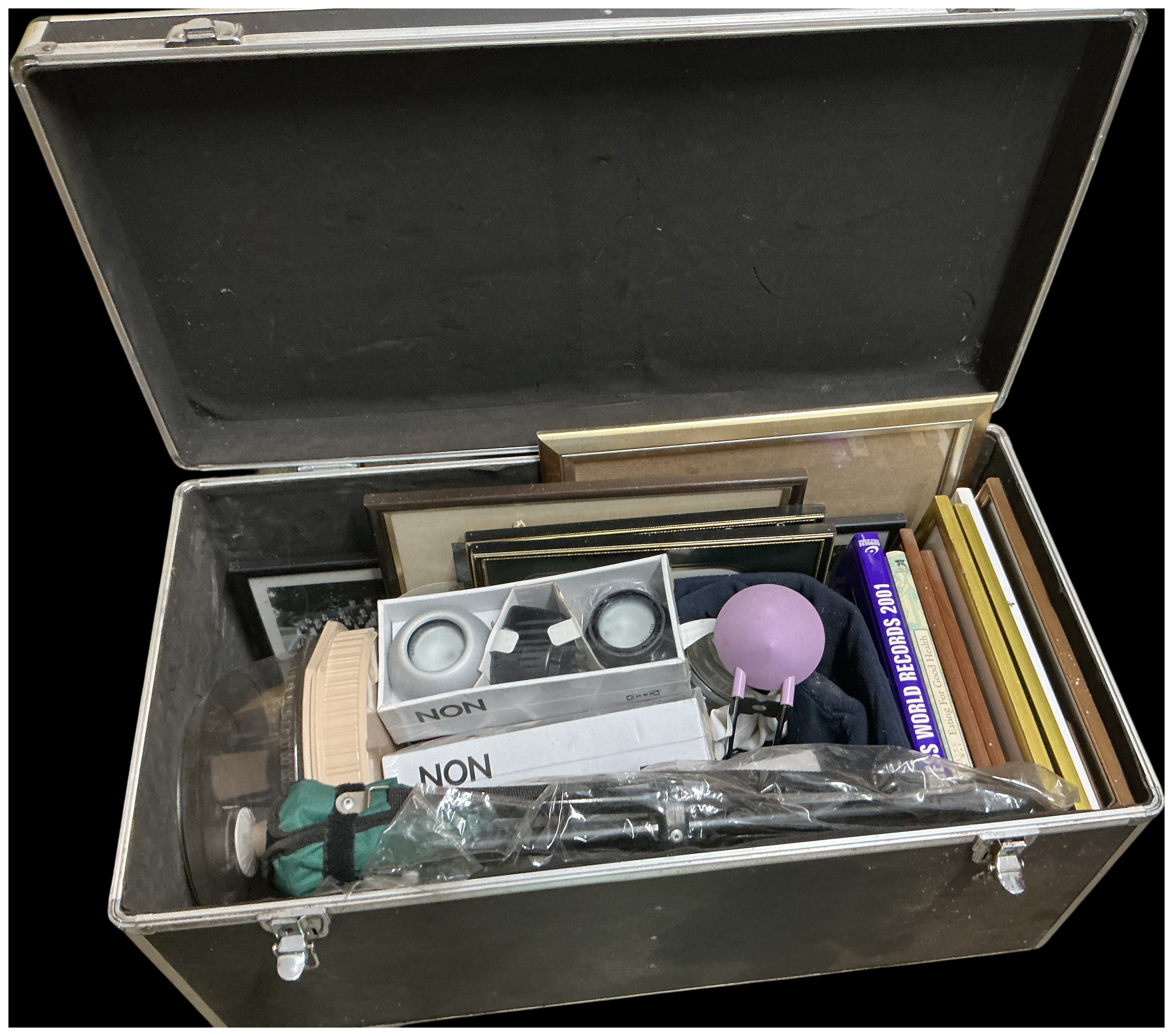 An Assortment of Miscellaneous Household Items, Books, and Media Accessories within a Large Flight Case