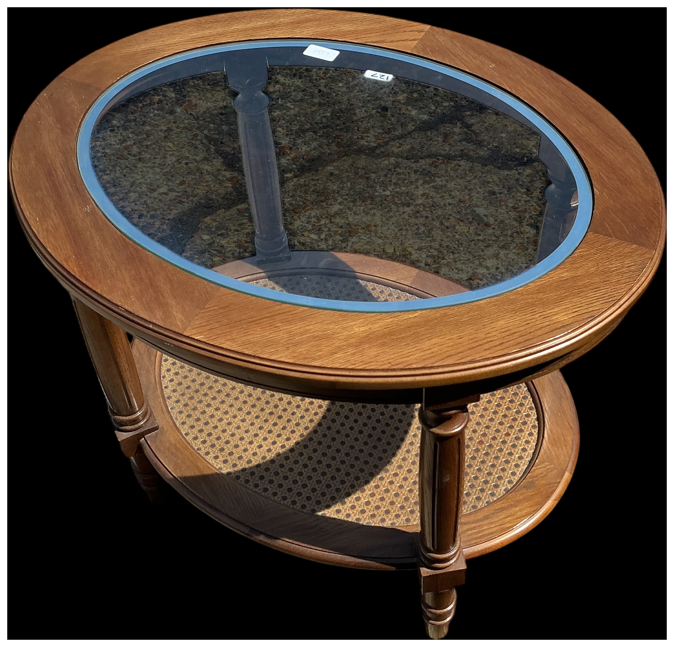 A Mid-20th Century Oval Two-Tier Glass Top and Cane Coffee Table