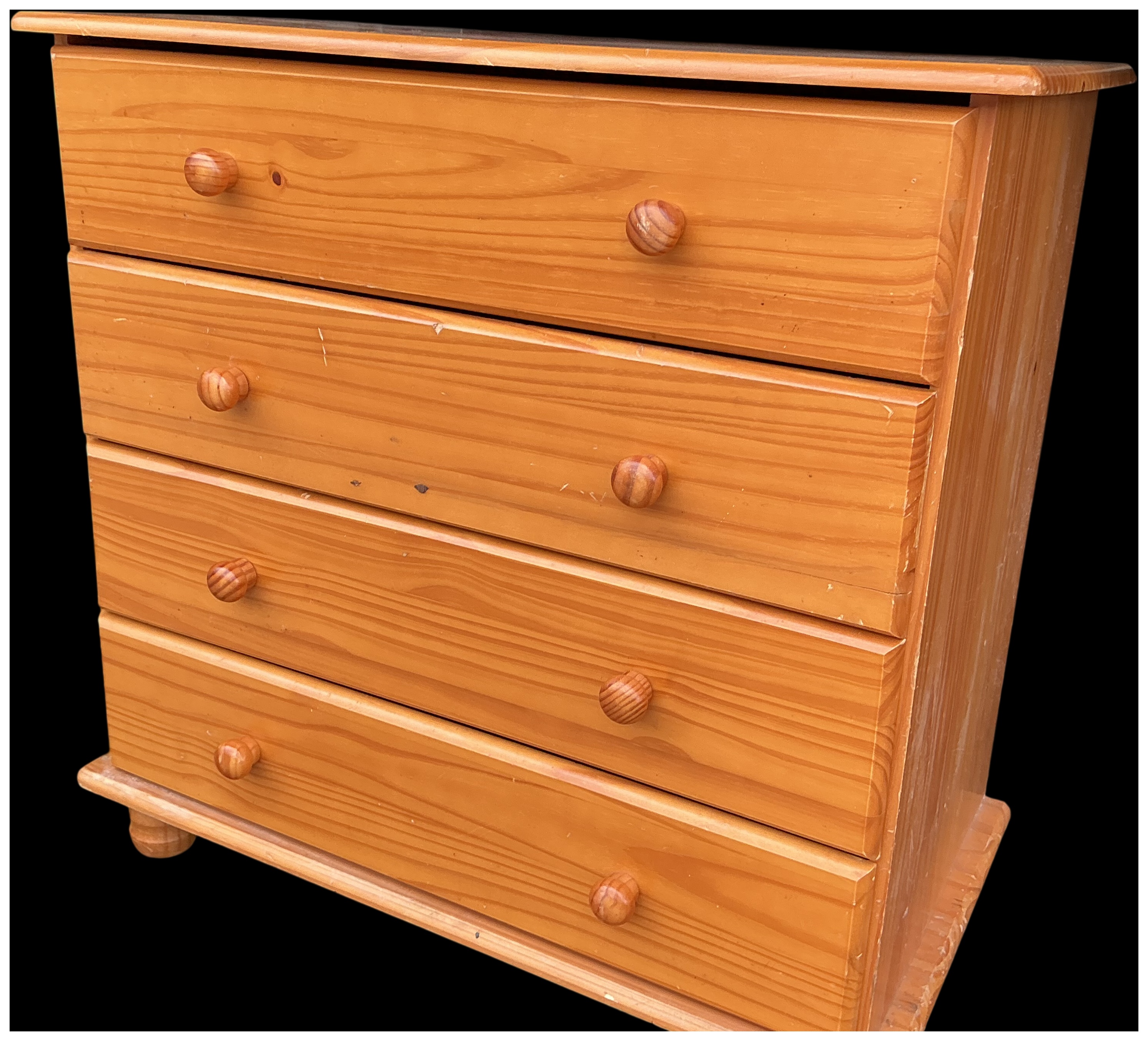 A modern pine chest of four drawers