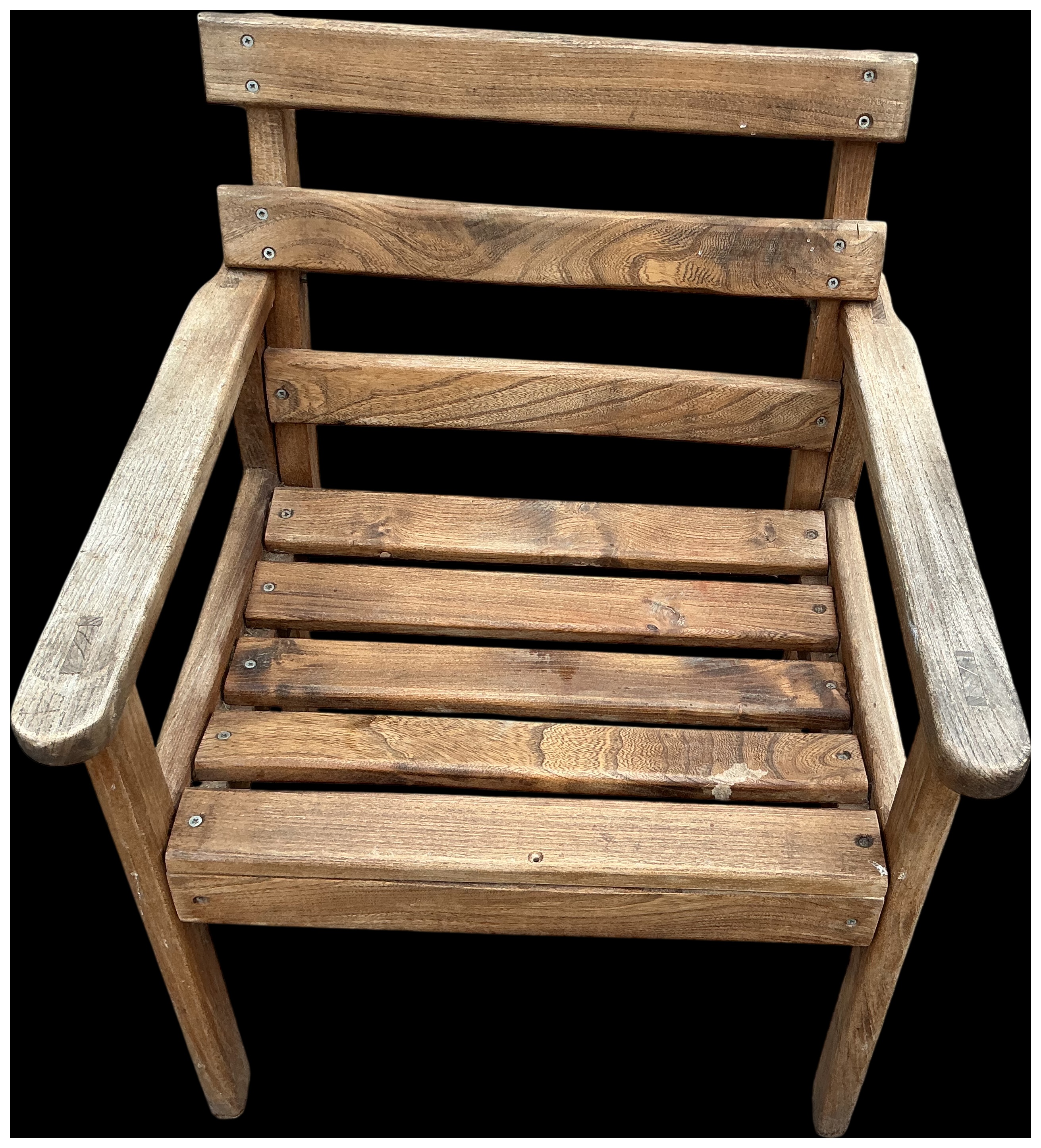 A weathered hardwood slatted garden armchair