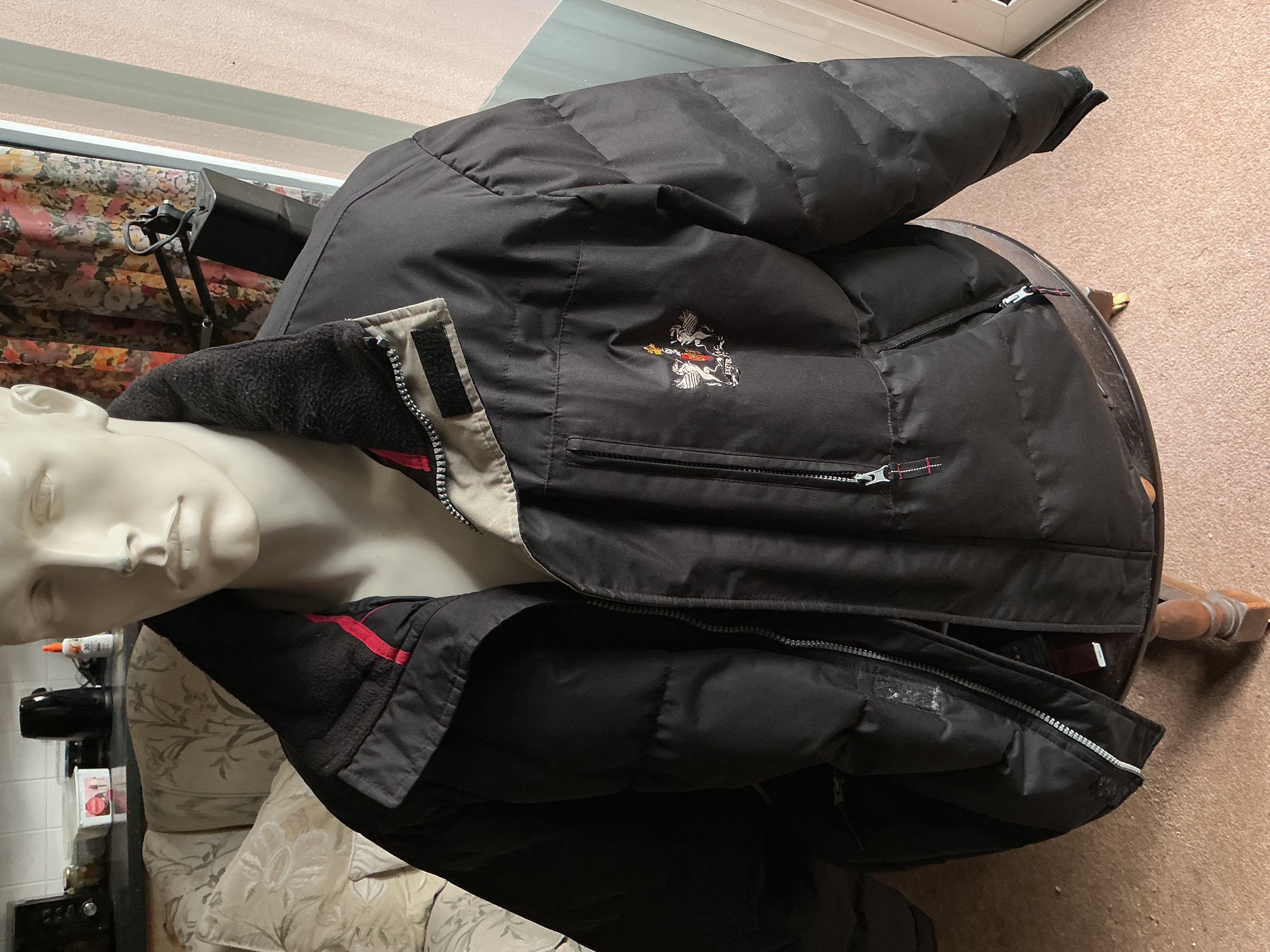 A Men's Vintage Black Padded Puffer Jacket with Embroidered Heraldic Crest