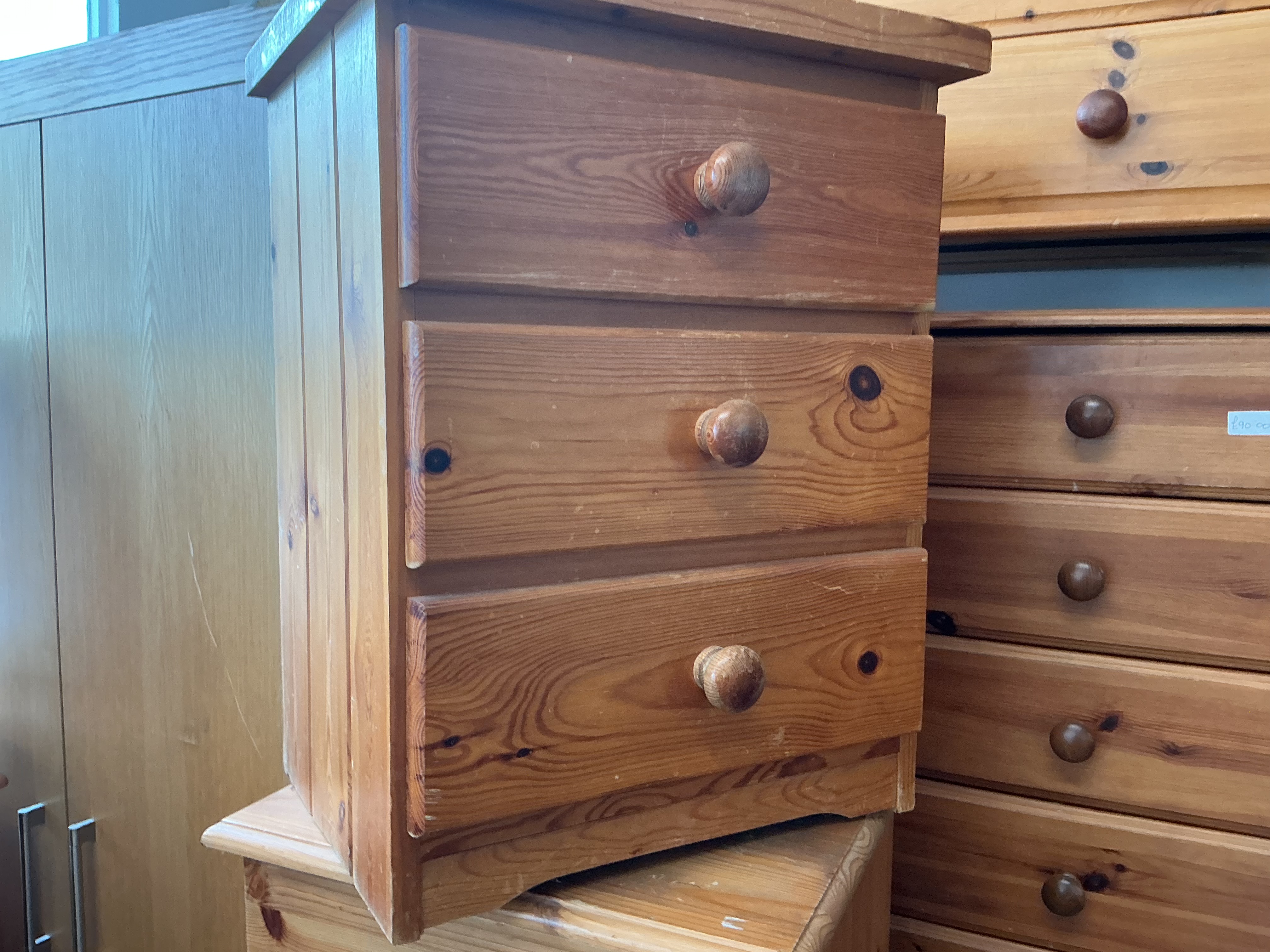 A Modern Pine Three-Drawer Bedside Chest