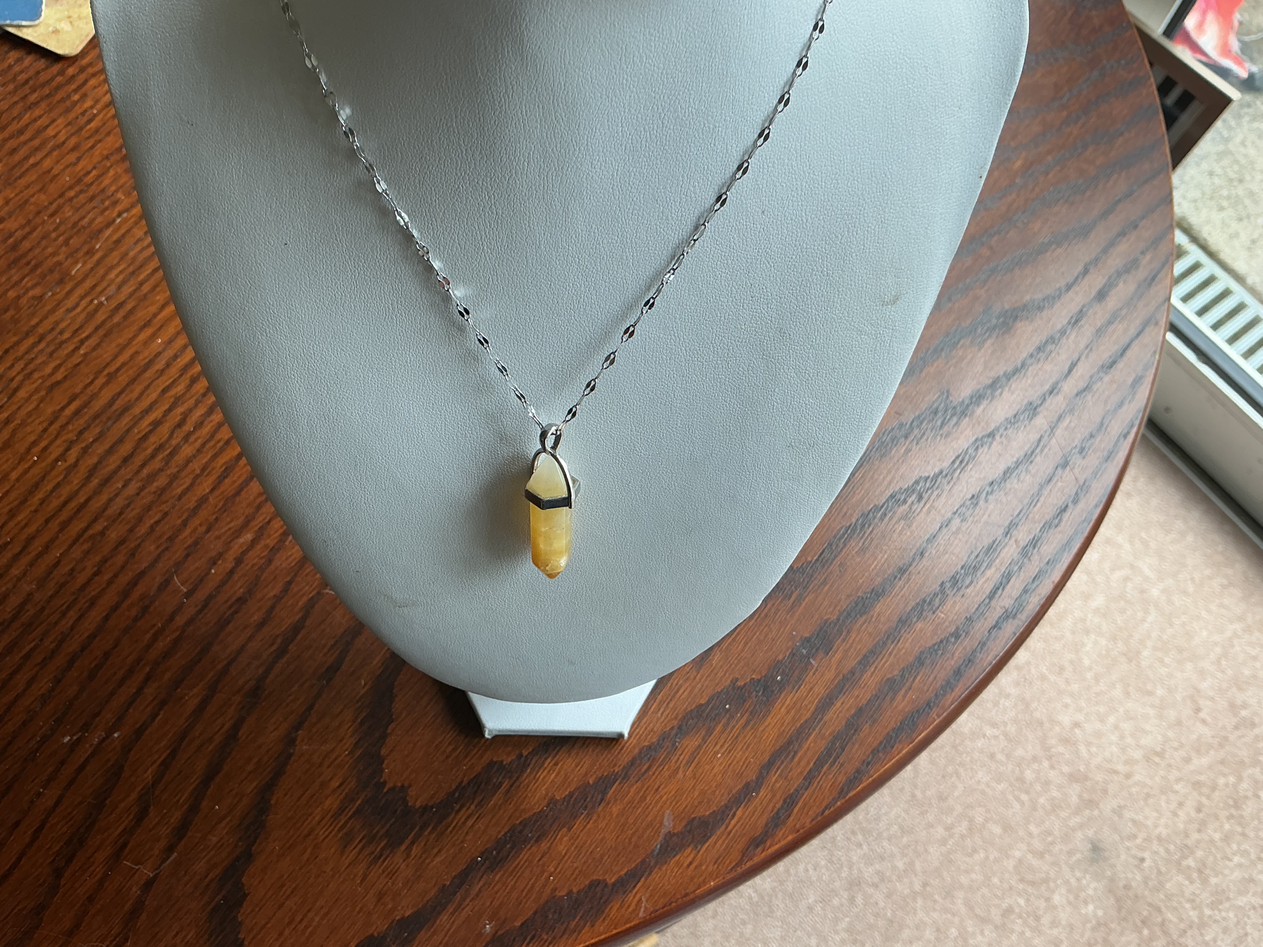 July. Yellow Semi-Precious Stone Point Pendant on a Silver-Toned Chain