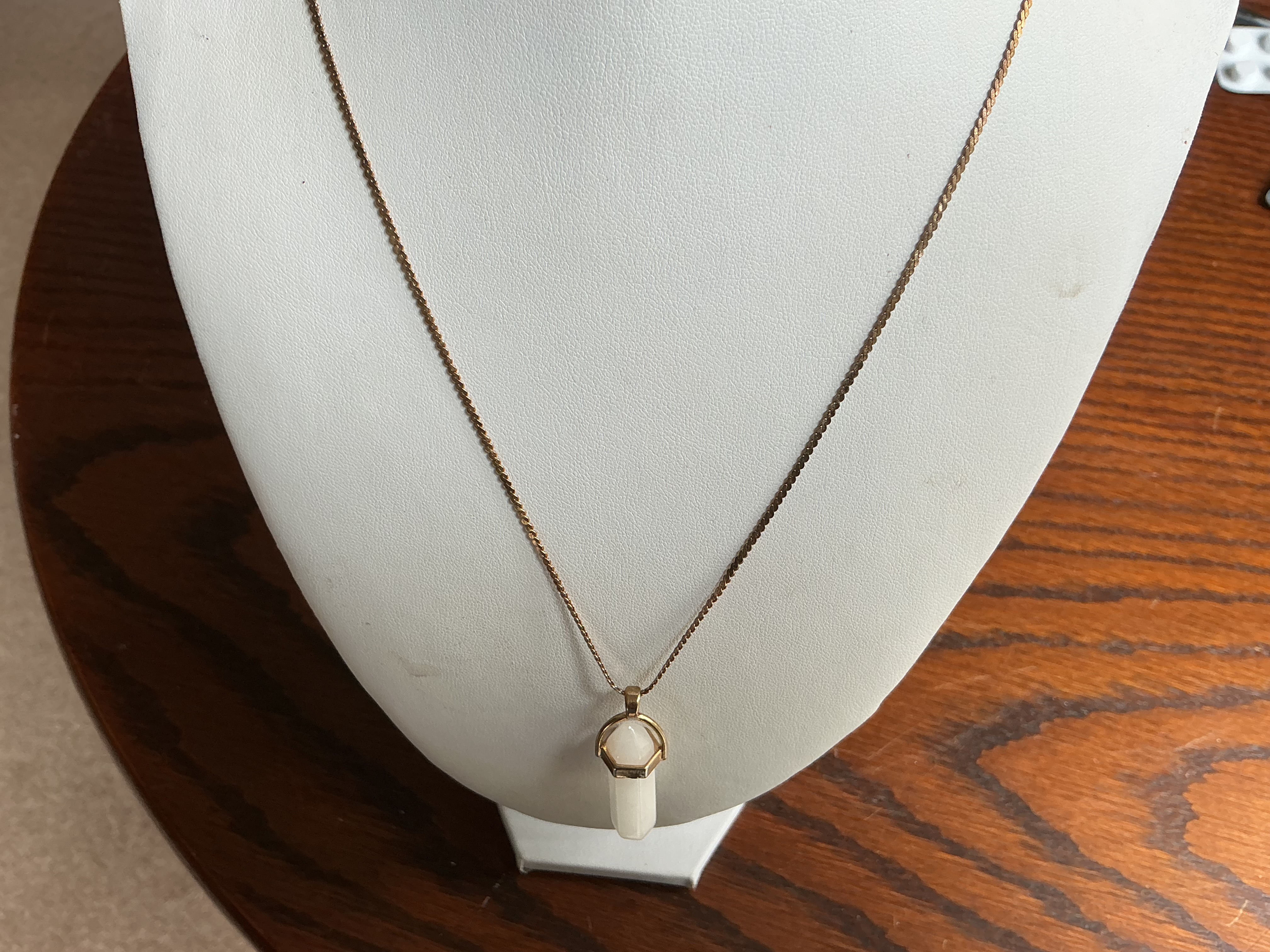 April. Gold-Toned Fine Link Chain Necklace with a Faceted White Gemstone Point Pendant