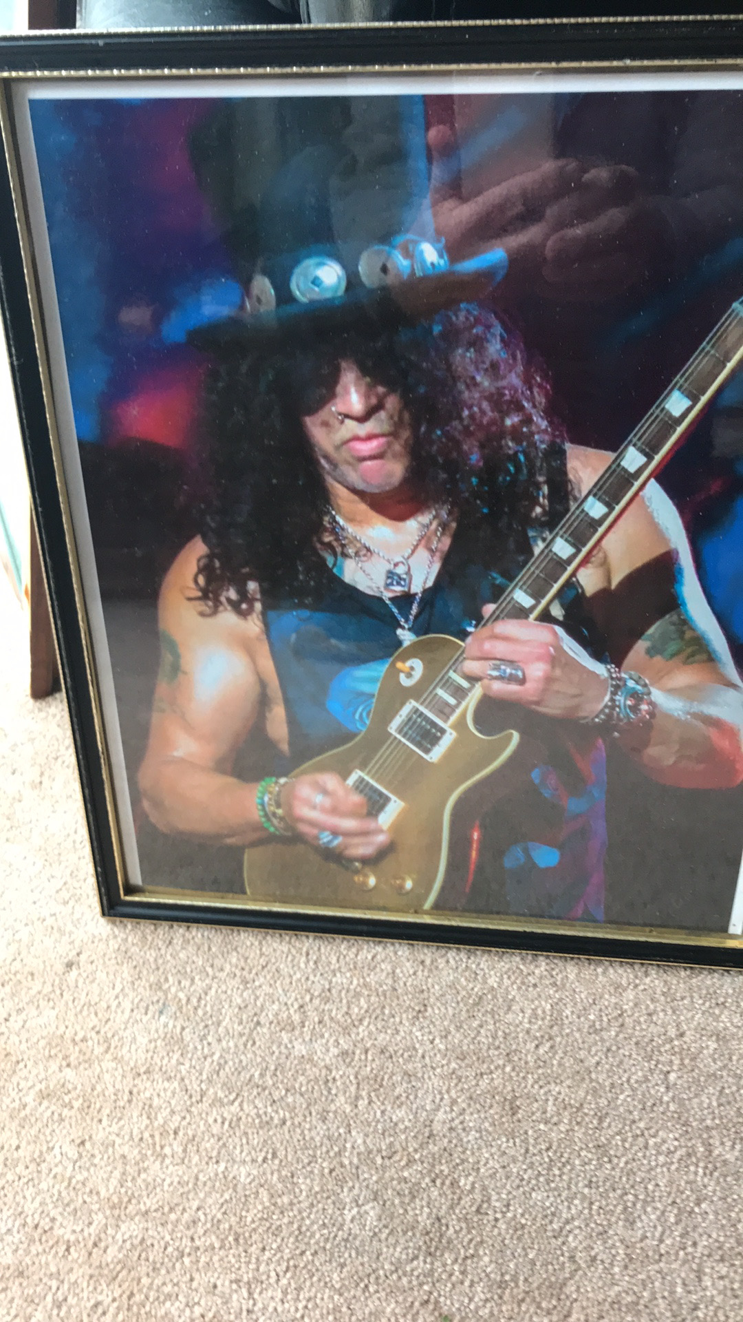 A Framed Photographic Print of Slash Attributed to Mal Bray