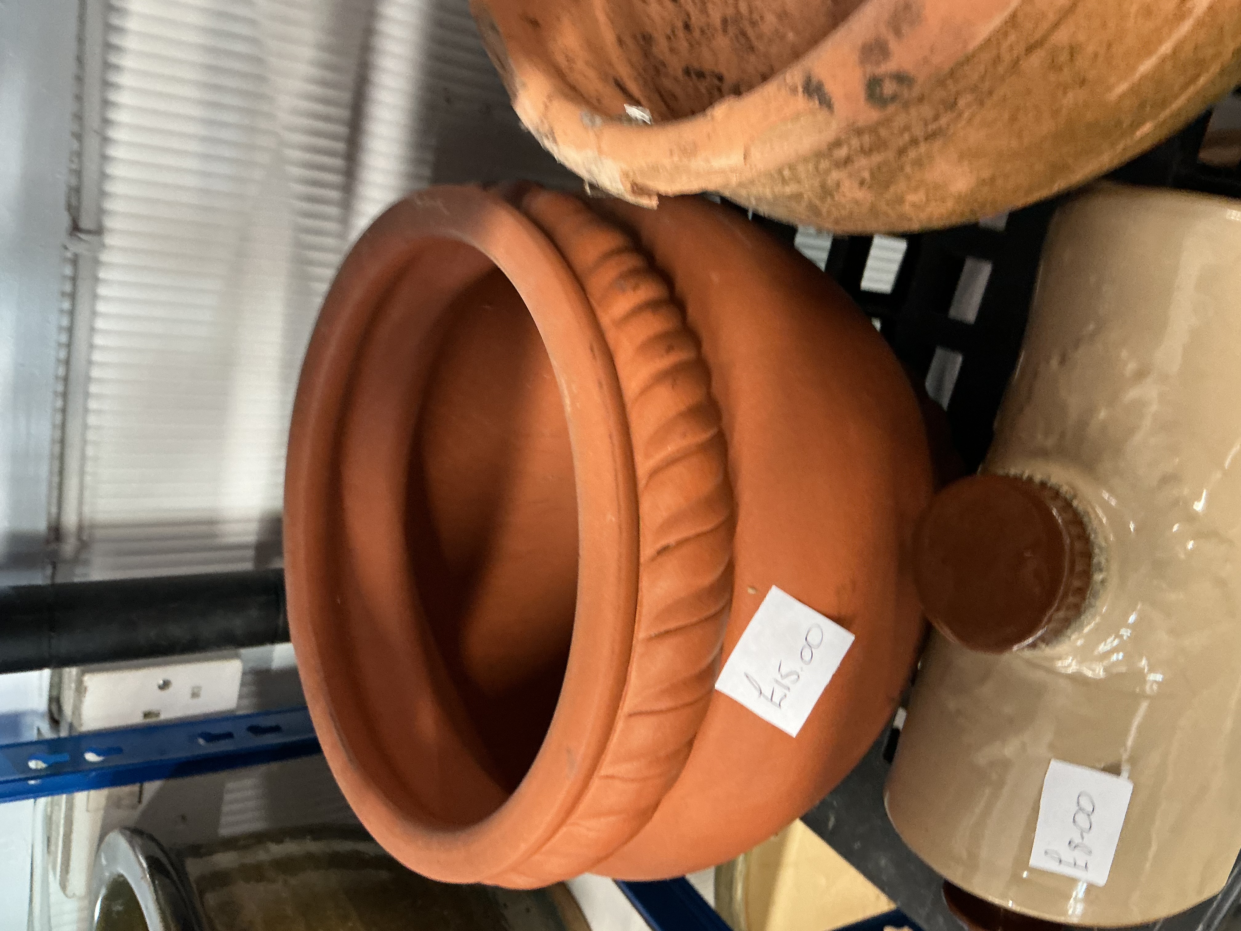 An Assortment of Rustic Garden and Domestic Ware Including Terracotta Planters and a Stoneware Foot Warmer
