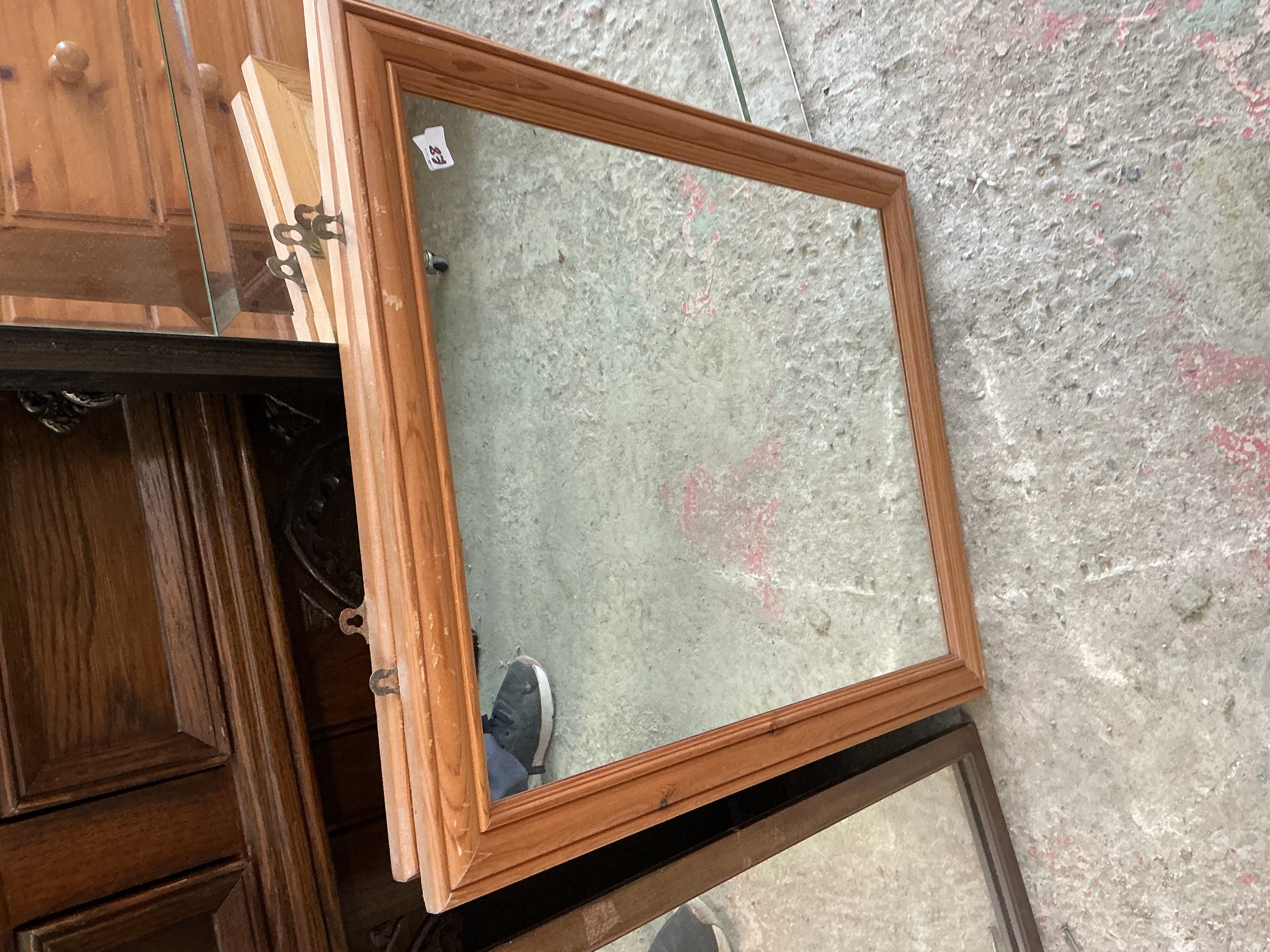 A Rectangular Pine Framed Mirror