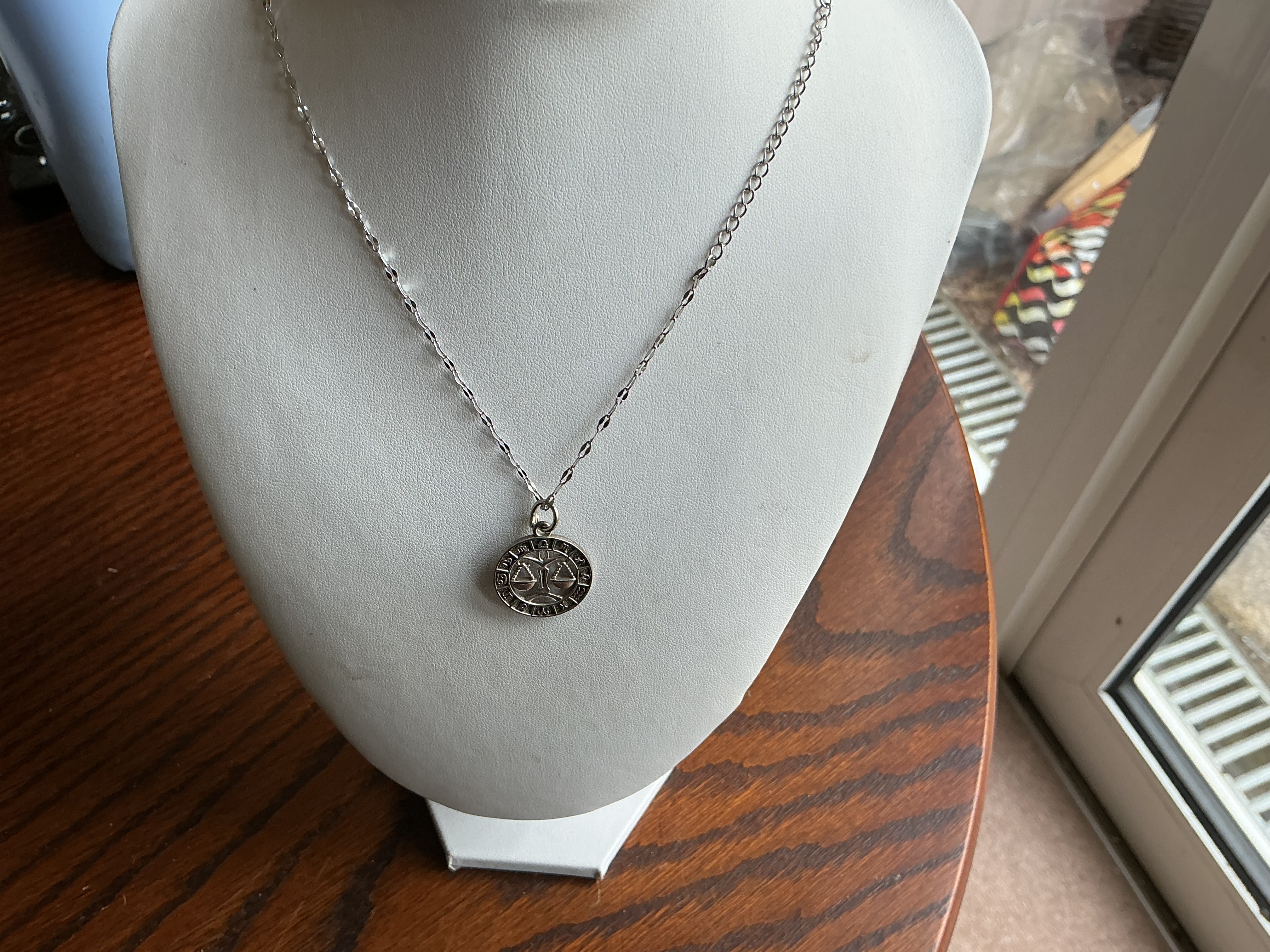 Libra. A Sterling Silver Libra Zodiac Pendant Necklace