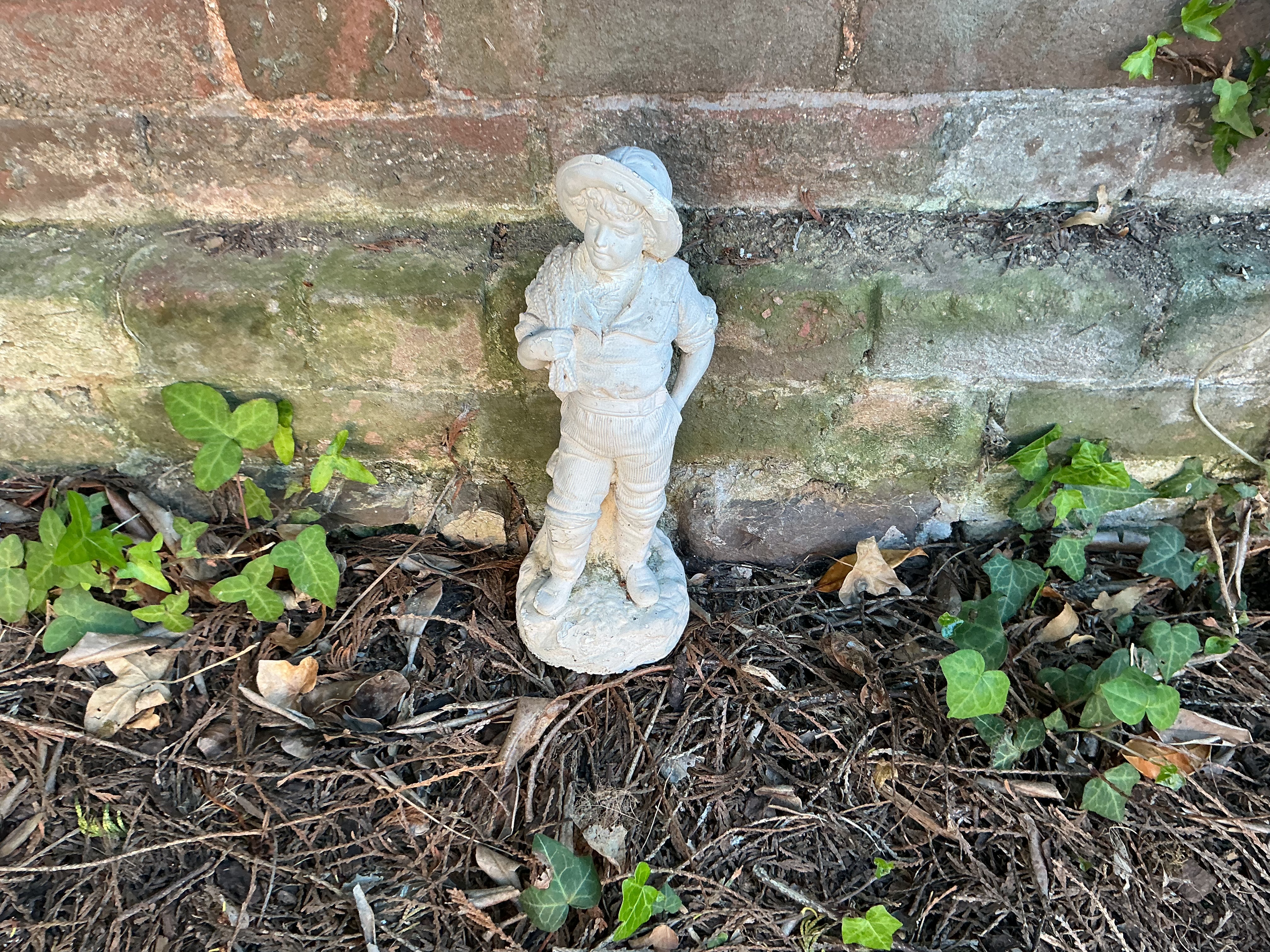 A Mid-20th Century Cast Reconstituted Stone Garden Statue of a Boy